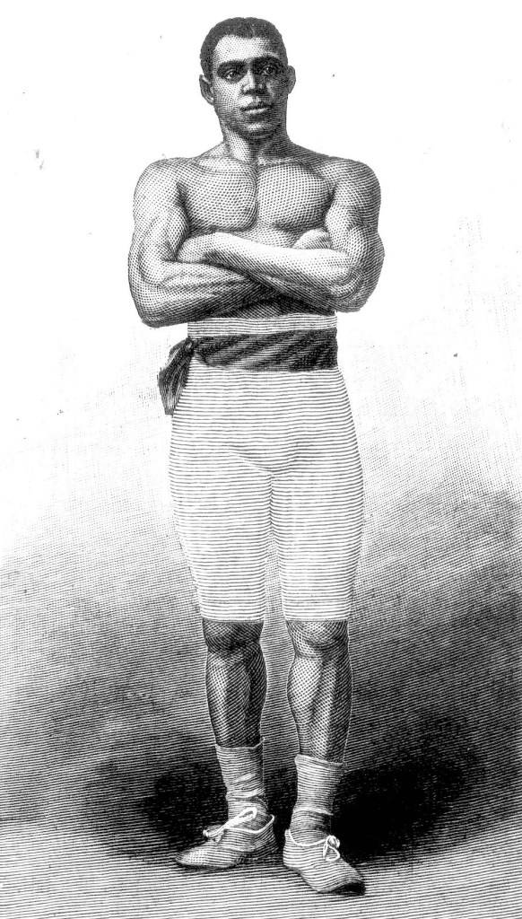 A black and white sketch based on a photo of Albert Pearce. It shows a muscular Black man in his 20s, posing with arms folded in front of his stomach. He wears knee length white tights and a striped sash around the waist. His face is handsome and he has close-cropped Afro hair with a faint centre parting. 